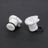Plugs-and-tuunels-Ear-gauges-Ear-expander